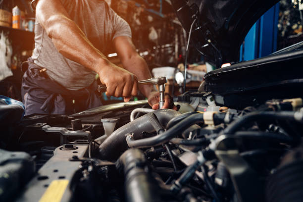The Triplet Auto Repair workshop floor with vehicles being serviced