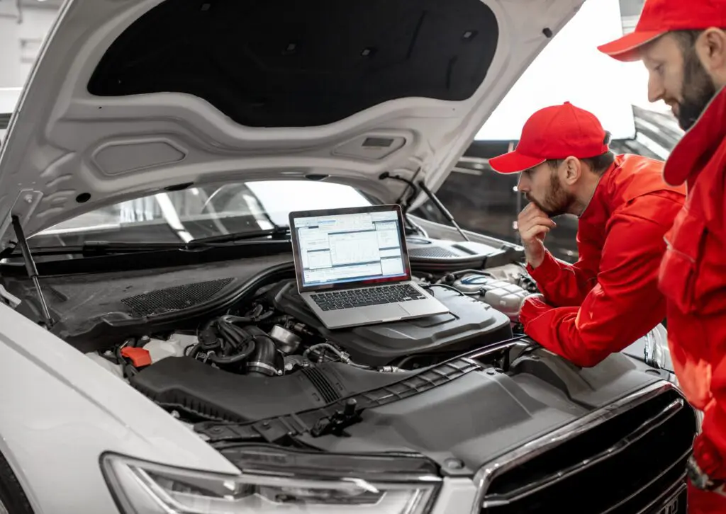 Technician using OBD-II diagnostic scanner